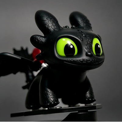Black Toothless dragon ornament close-up with green eyes and textured head