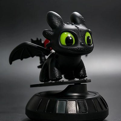 Black Toothless dragon dashboard ornament on rotating base, front three-quarter view