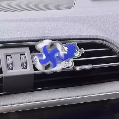 CARMOJ Blue Tom spinning AC vent decoration installed on a car air vent