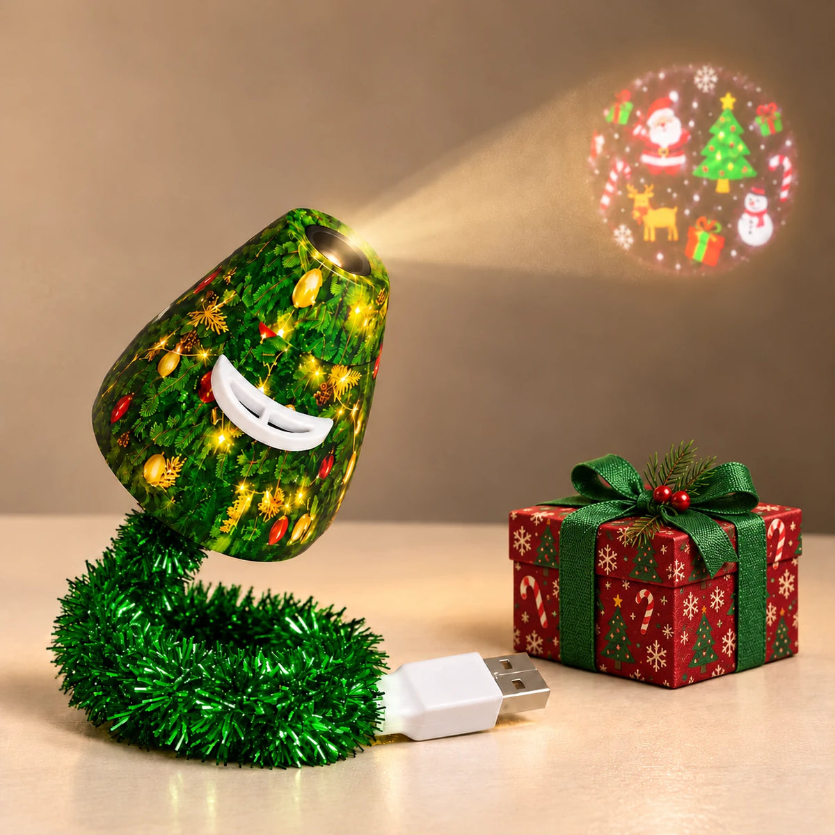 Christmas Tree USB Projector Light with compact green tinsel-wrapped cord and white USB plug, an illustrative aligned static Christmas projection, and a Christmas-patterned gift box prop.