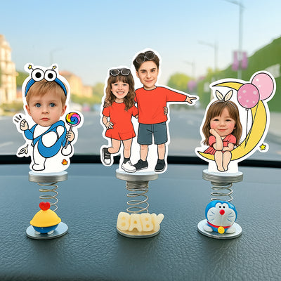CARMOJ Custom photo car bobbleheads displayed as a group on a dashboard