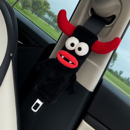 CARMOJ Demon plush seat belt shoulder pad installed inside a car