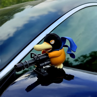 Hooded Gatling Psyduck ornament mounted on a car hood near the windshield