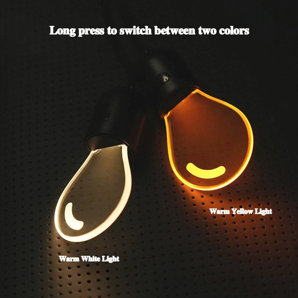 CARMOJ Glowing light bulb car charm showing warm white and orange light colors