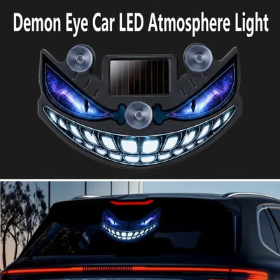 CARMOJ Solar-powered Demon Eye LED car light showing blue eyes on a rear window