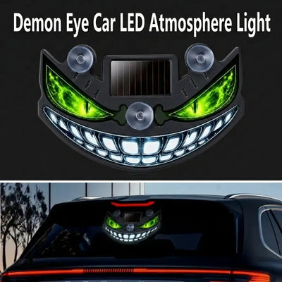 CARMOJ Solar-powered Demon Eye LED car light showing green eyes on a rear window