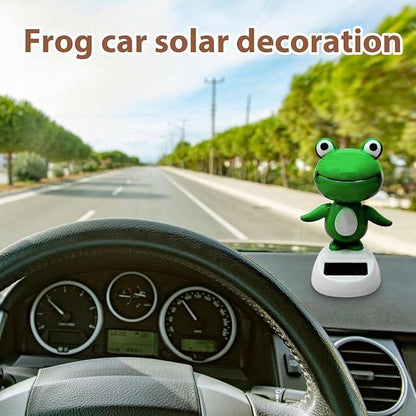CARMOJ Solar-powered frog car ornament installed in front of the driver