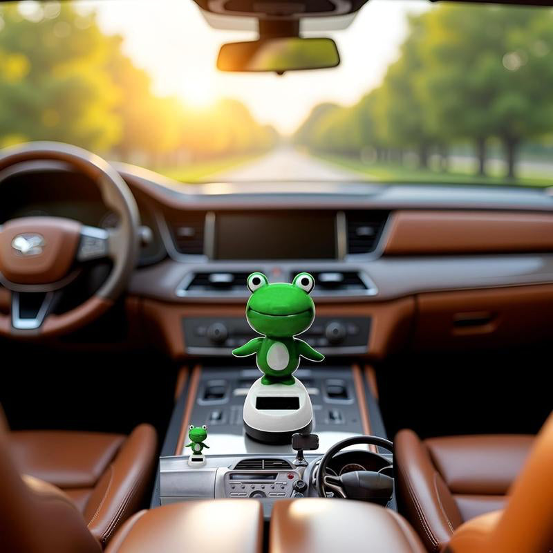 CARMOJ Solar-powered frog car ornament installed inside a car