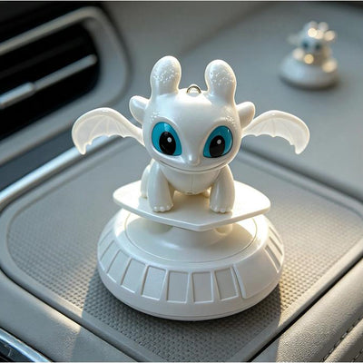 White Light Fury dragon ornament with base displayed on a car dashboard