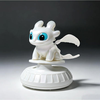 White Light Fury dragon ornament on base, side three-quarter view